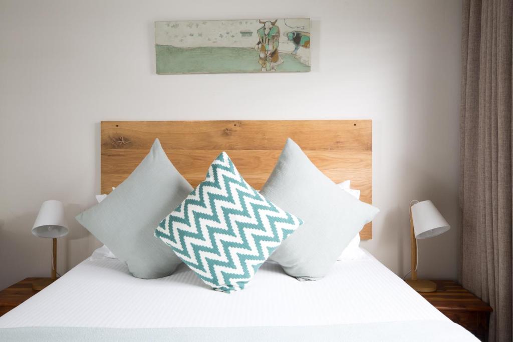 A bed or beds in a room at The Ashford