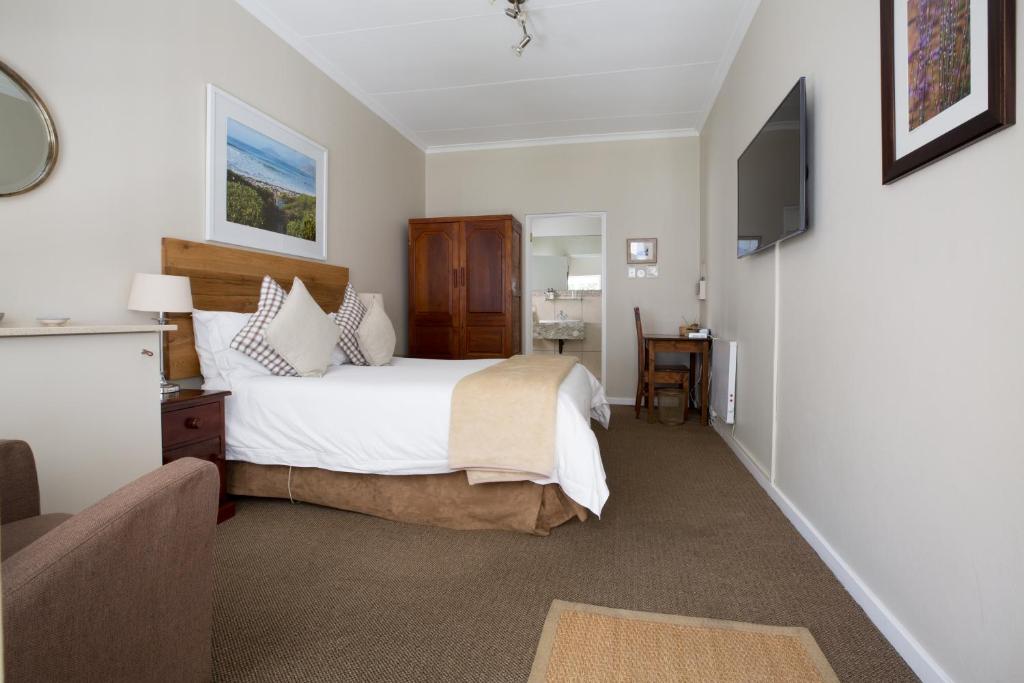 A bed or beds in a room at The Ashford