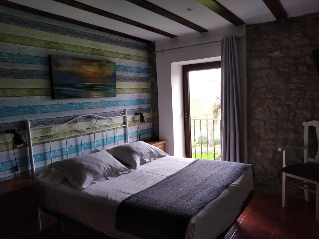 Cama o camas de una habitación en Posada Punta Liñera