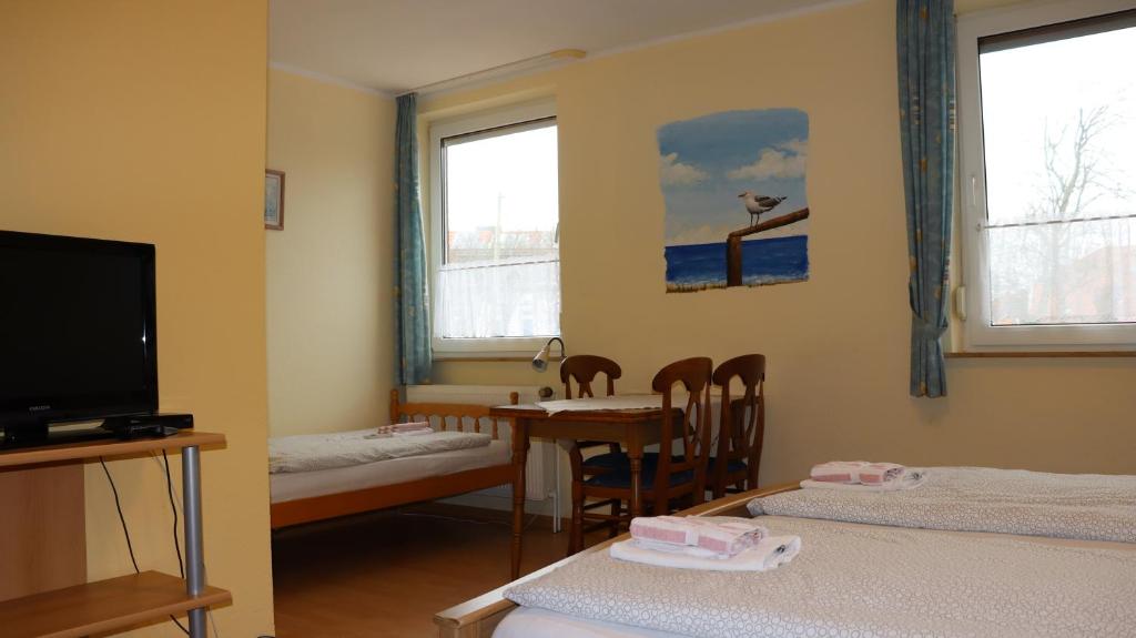 TV a/nebo společenská místnost v ubytování Logia Hotel garni