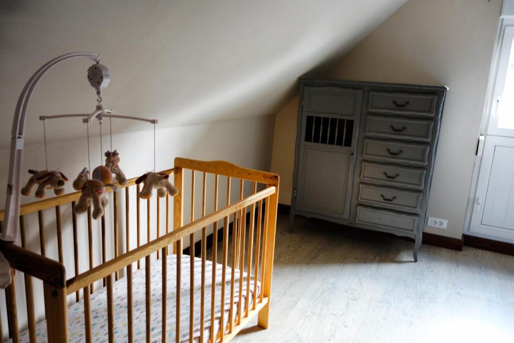 Postel nebo postele na pokoji v ubytování Gîte rural Les petites têtes