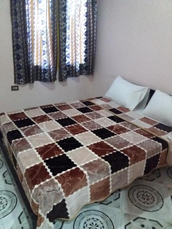 Postel nebo postele na pokoji v ubytování Pharaohs Hotel