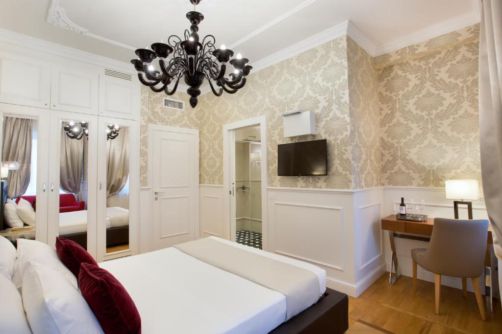 Posteľ alebo postele v izbe v ubytovaní Duomo Rooms