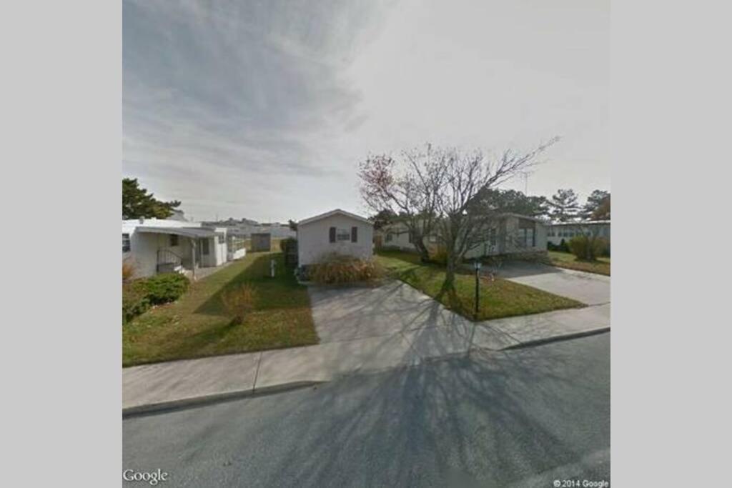 an empty street in front of a house at Dorothy and Johns Ocean City Md Vacation Home Sleeps 8 - 3 bedrooms 2 full bath in Ocean City