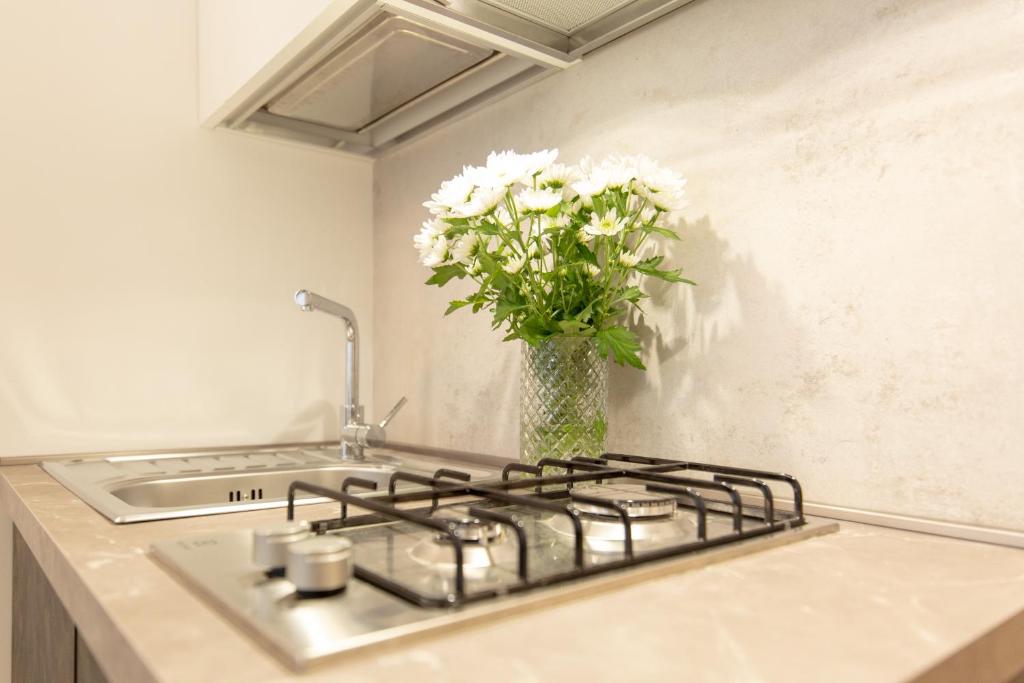A kitchen or kitchenette at " CASA IDA " centro storico