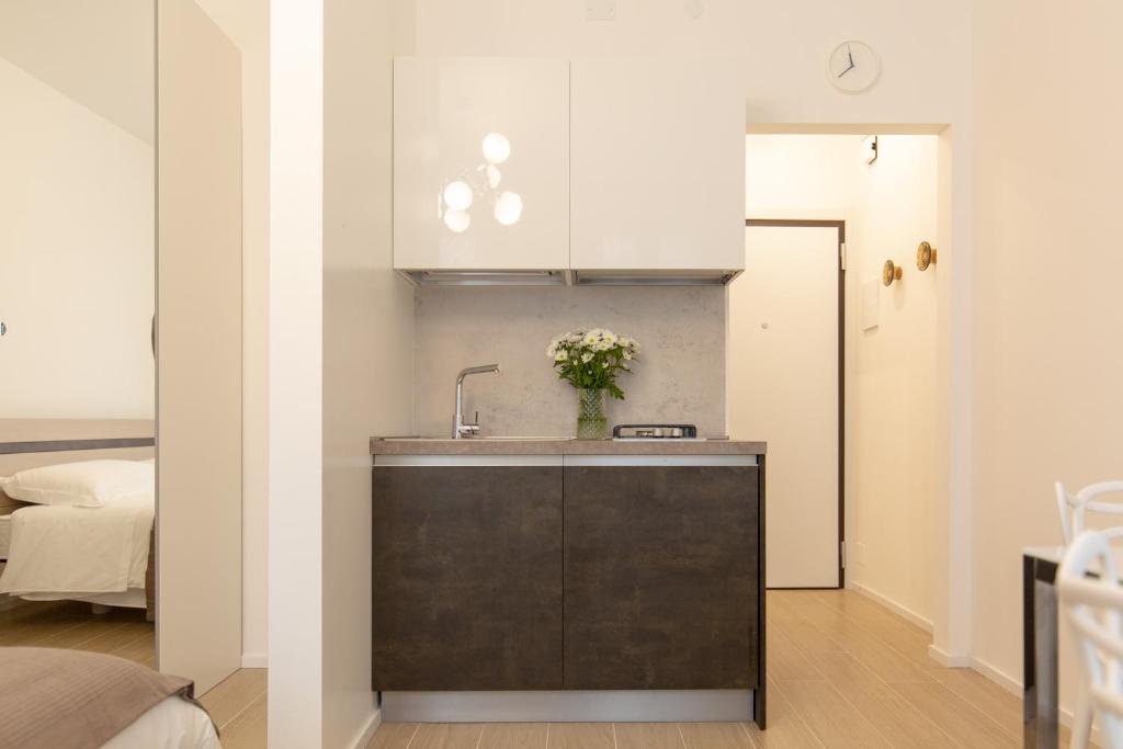 A kitchen or kitchenette at " CASA IDA " centro storico