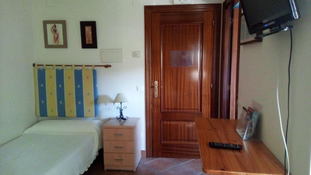 A bed or beds in a room at Pension zelaigane