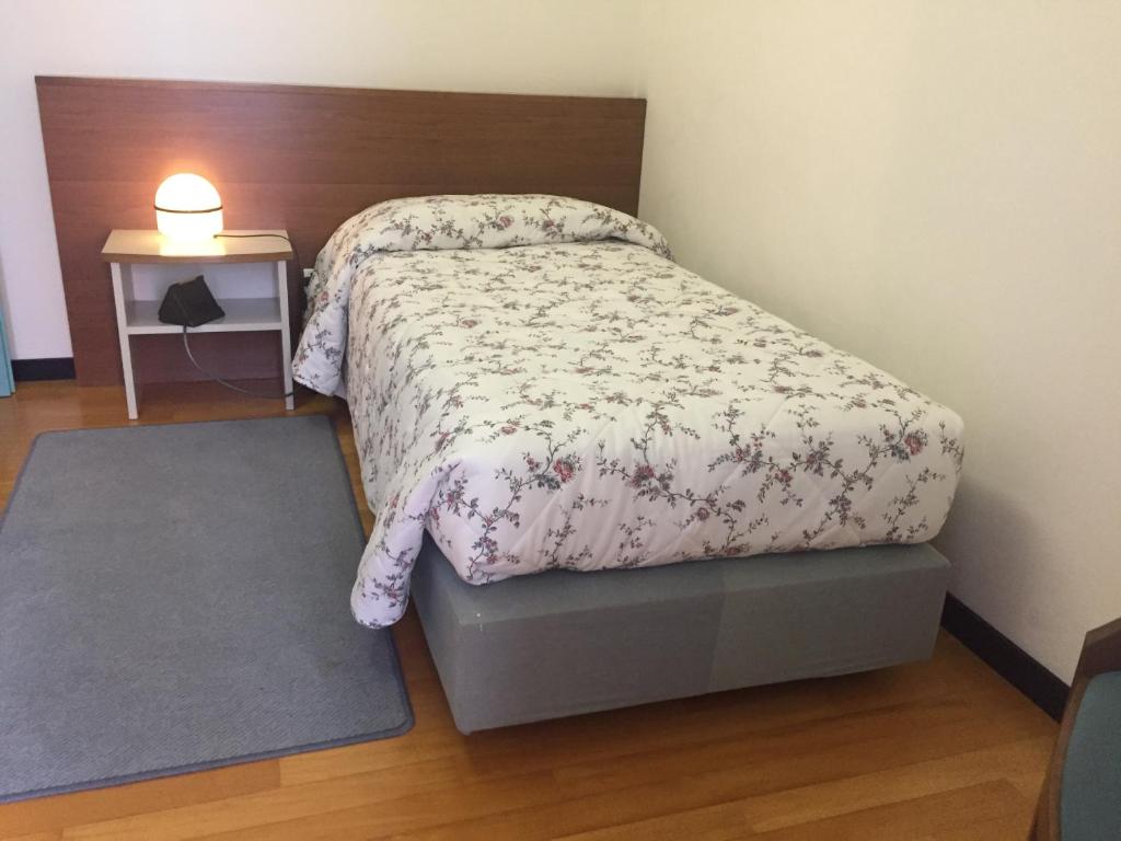 Łóżko lub łóżka w pokoju w obiekcie Casaalbergo La Rocca