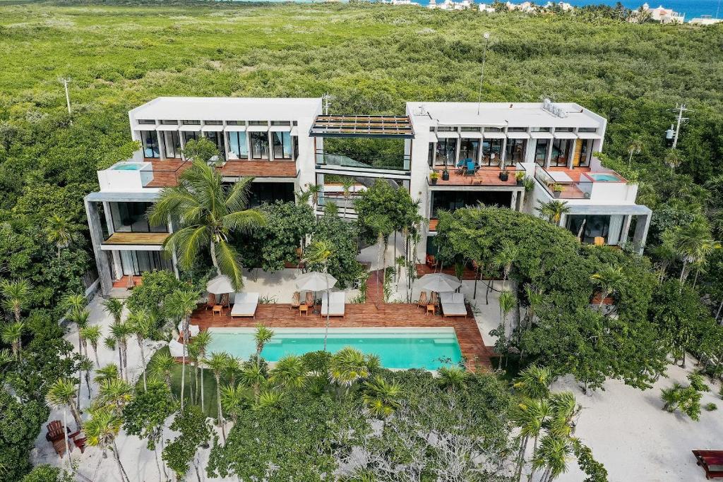 an aerial view of a house with a swimming pool at Tulsayab luxury development in Tulum