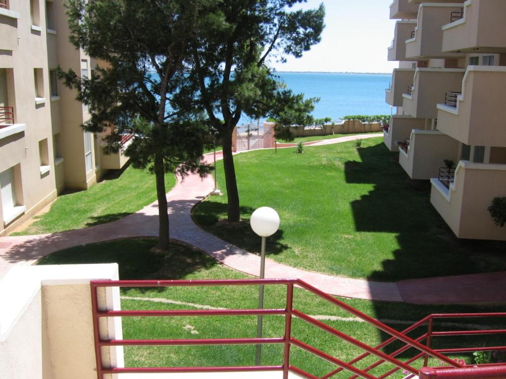 a view of the ocean from the balcony of a building at 1ª LINEA DE MAR CON VISTA FANTÁSTICA in L'Ampolla