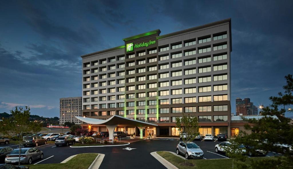 a rendering of a hotel with a parking lot at Holiday Inn Alexandria at Carlyle, an IHG Hotel in Alexandria