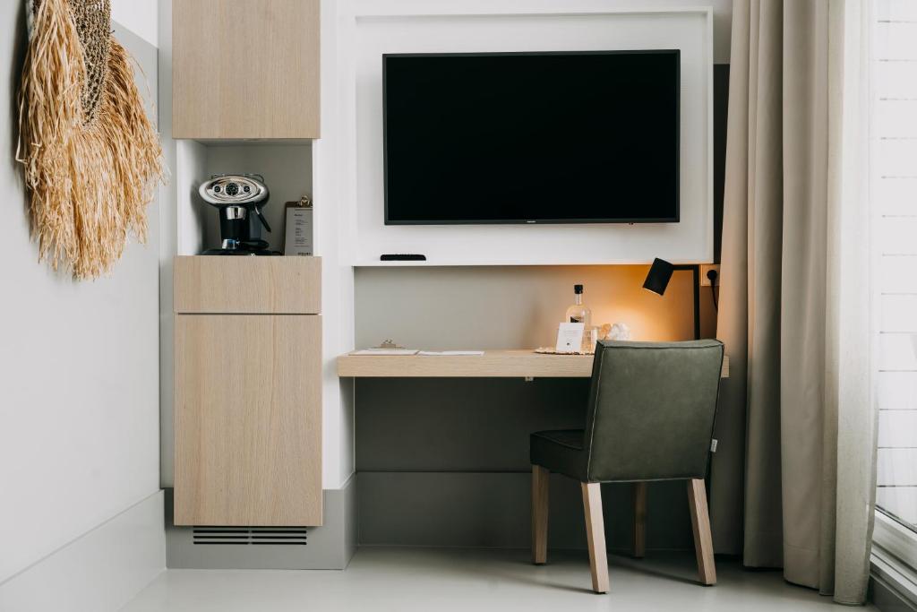 Strandhotelにあるテレビまたはエンターテインメントセンター