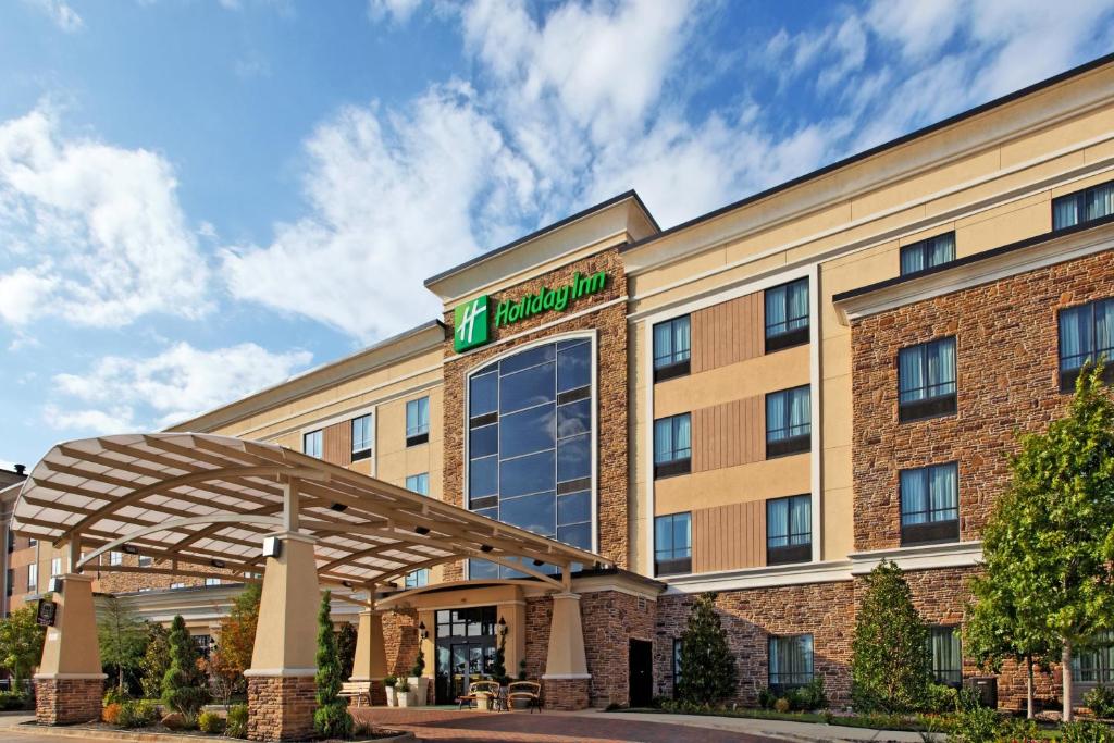 a large building with a clock on the front of it at Holiday Inn Arlington Northeast, an IHG Hotel in Arlington