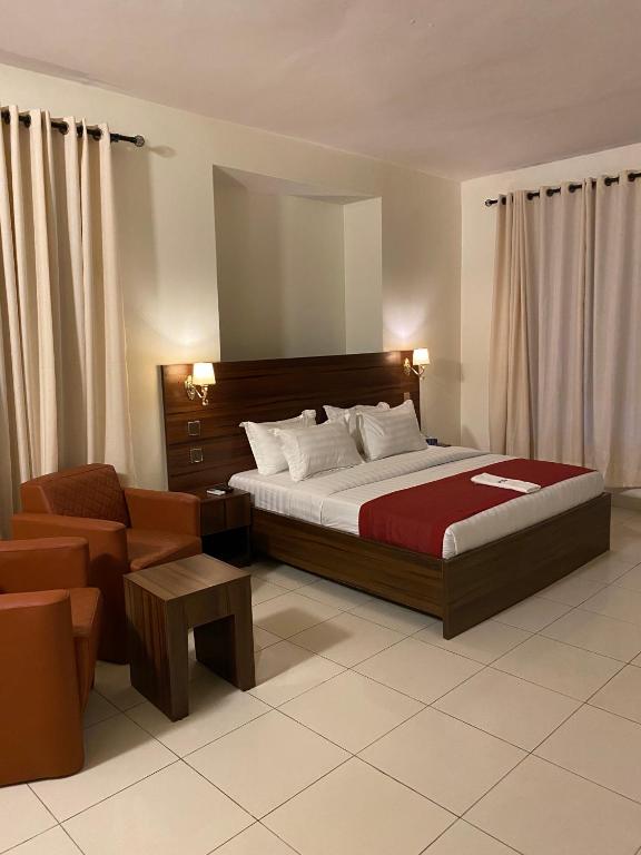 Postel nebo postele na pokoji v ubytování Posh Hotel and Suites Victoria Island