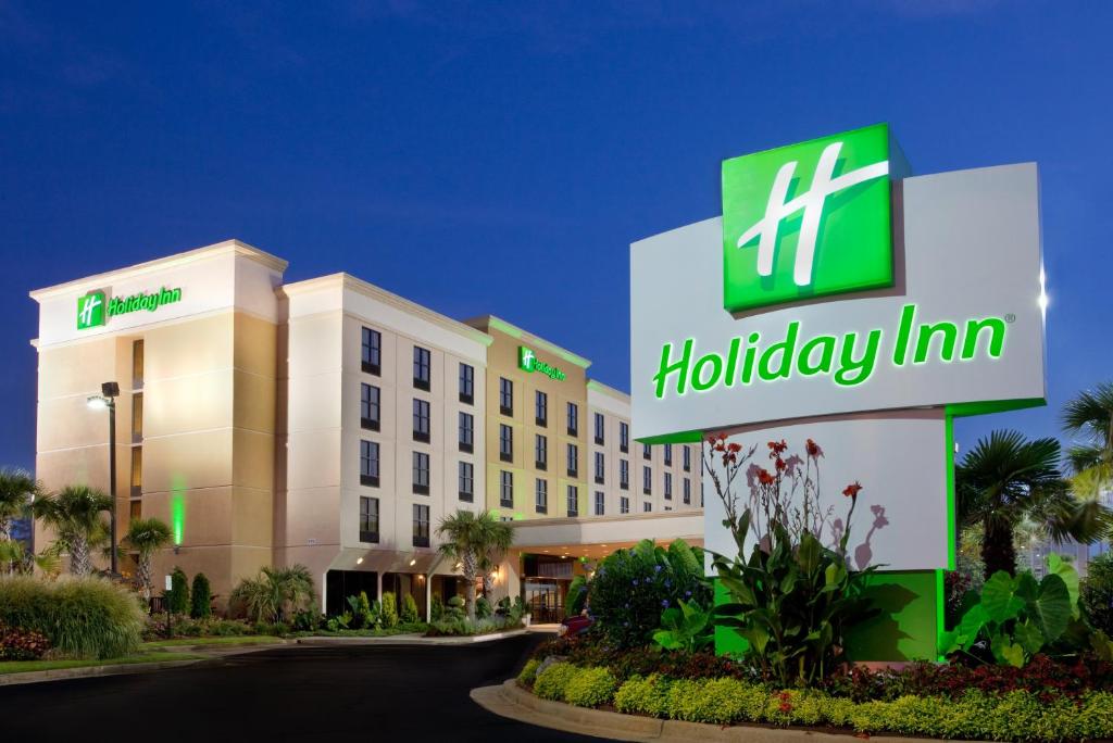 a hotel with a holiday inn sign in front of it at Holiday Inn Hotel Atlanta-Tucker, a Full Service Hotel in Atlanta