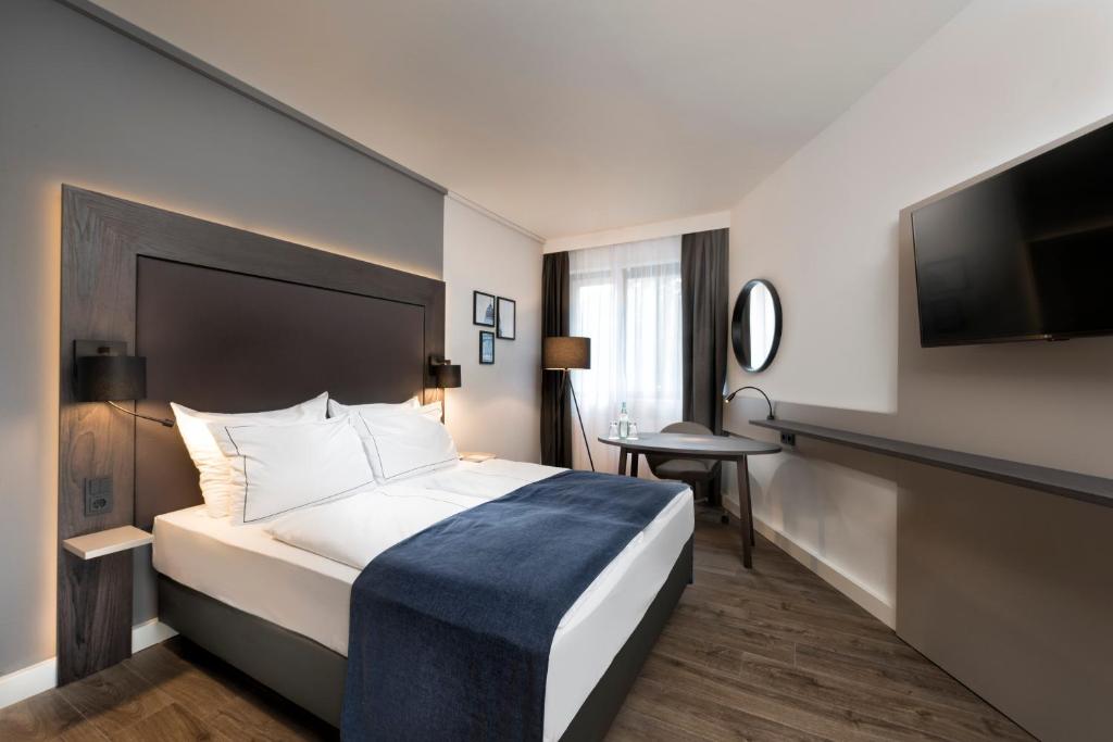 Postel nebo postele na pokoji v ubytování Holiday Inn Berlin City-West by IHG
