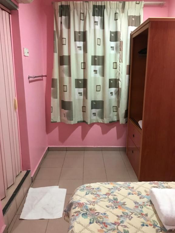 Postel nebo postele na pokoji v ubytování Hotel Cahaya