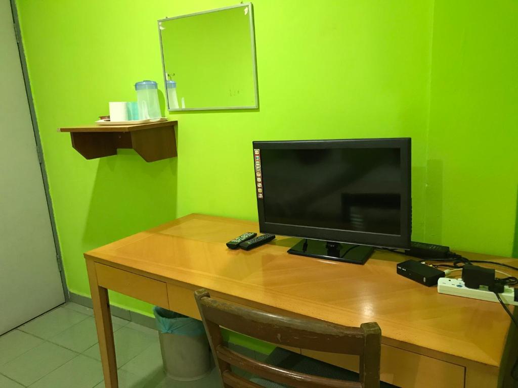 TV a/nebo společenská místnost v ubytování Hotel Cahaya