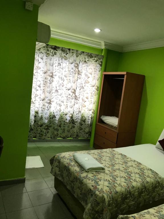 Postel nebo postele na pokoji v ubytování Hotel Cahaya