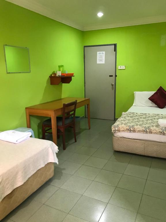 Postel nebo postele na pokoji v ubytování Hotel Cahaya