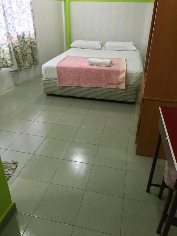 Postel nebo postele na pokoji v ubytování Hotel Cahaya