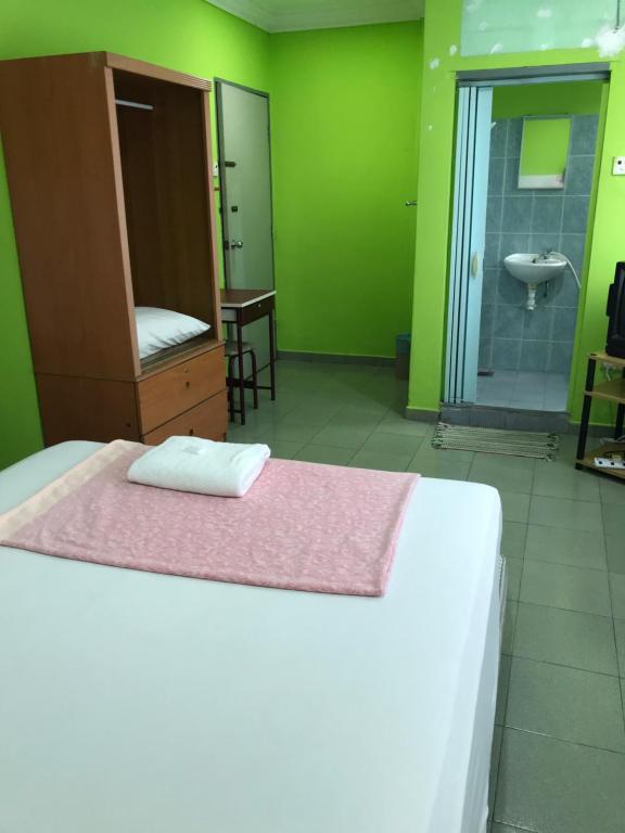 Postel nebo postele na pokoji v ubytování Hotel Cahaya