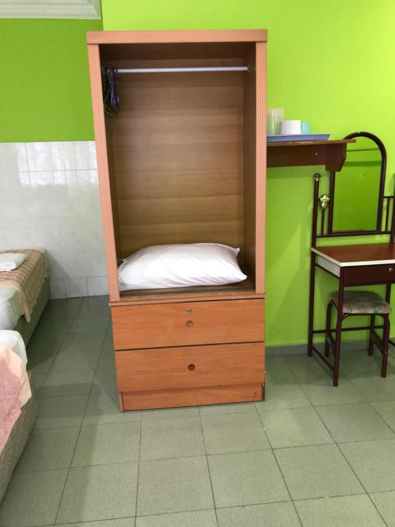 Postel nebo postele na pokoji v ubytování Hotel Cahaya