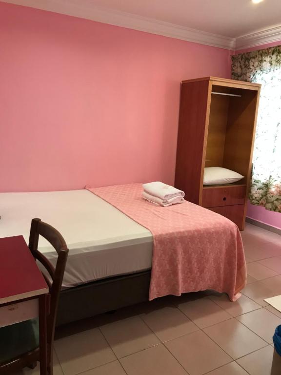 Postel nebo postele na pokoji v ubytování Hotel Cahaya