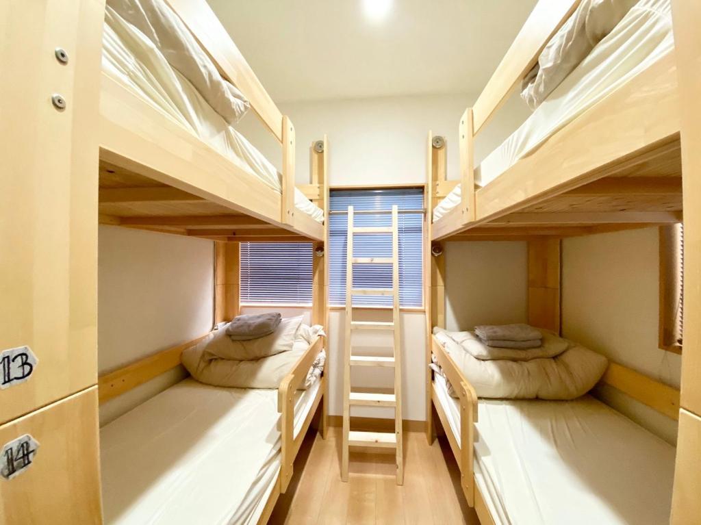Postel nebo postele na pokoji v ubytování Upper Hotel Ryogoku