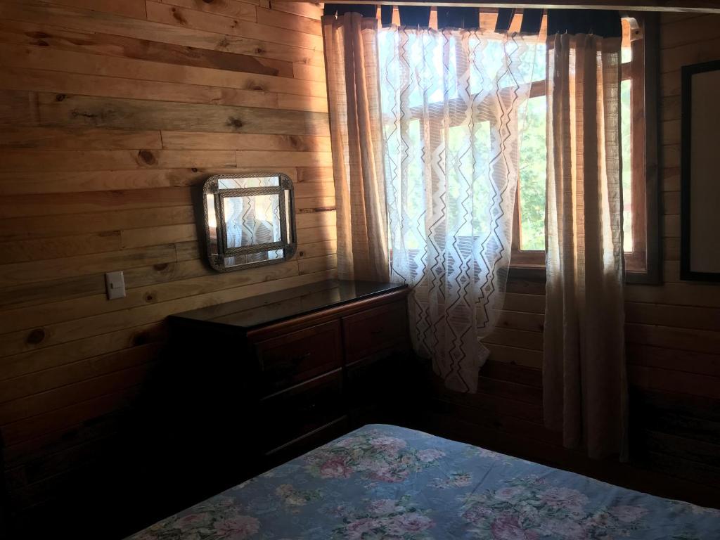 Postel nebo postele na pokoji v ubytování Cabañas Yasmina