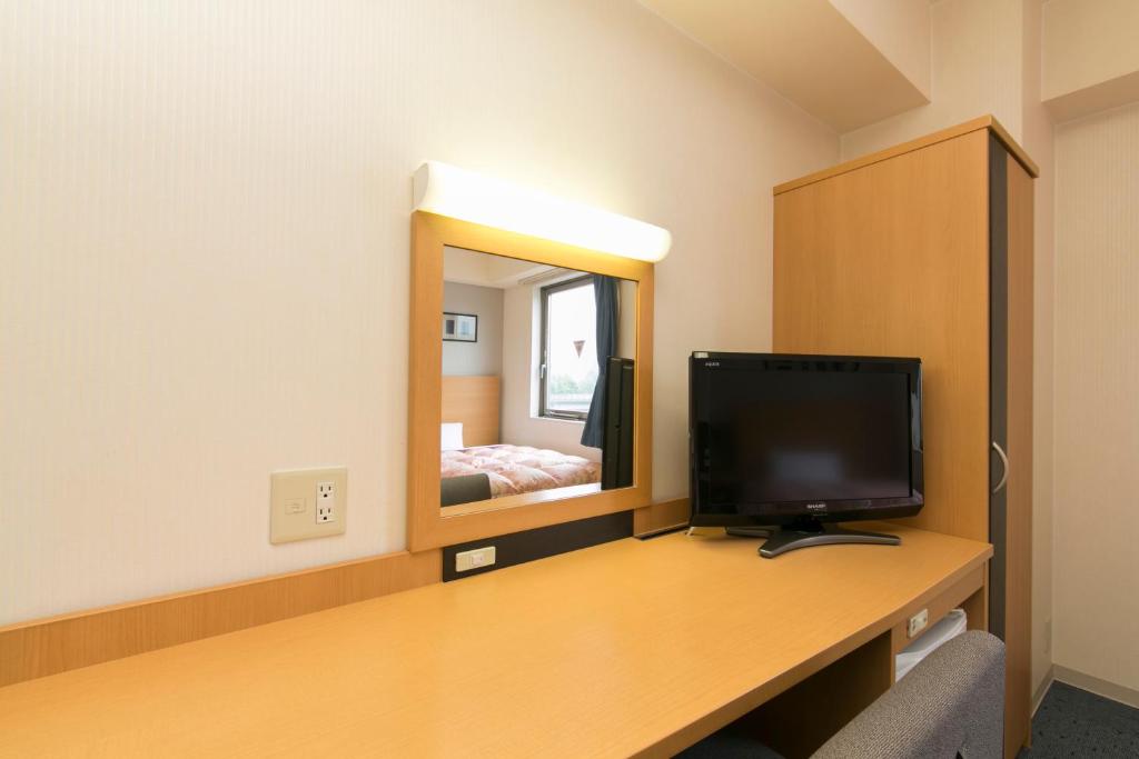 TV a/nebo společenská místnost v ubytování Hotel Econo Taki
