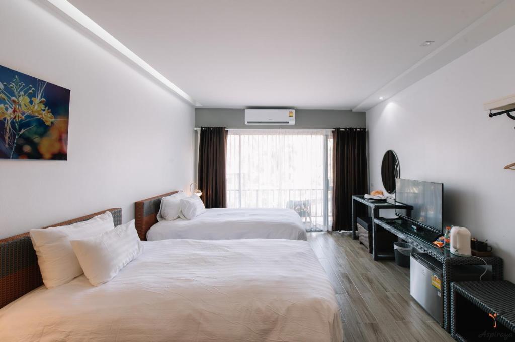 Postel nebo postele na pokoji v ubytování Aspiraya Resort