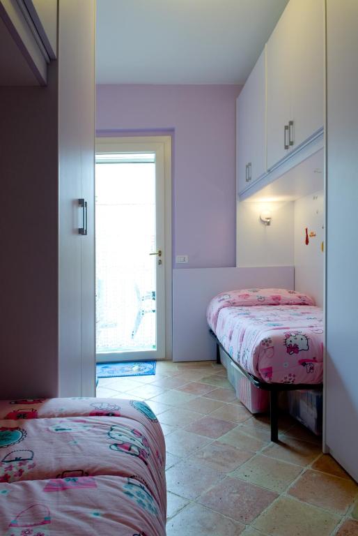 Posteľ alebo postele v izbe v ubytovaní Lo Squero Rooms and Apartments