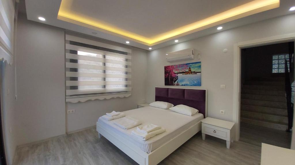 A bed or beds in a room at Private Villa in Gocek Villa Perest