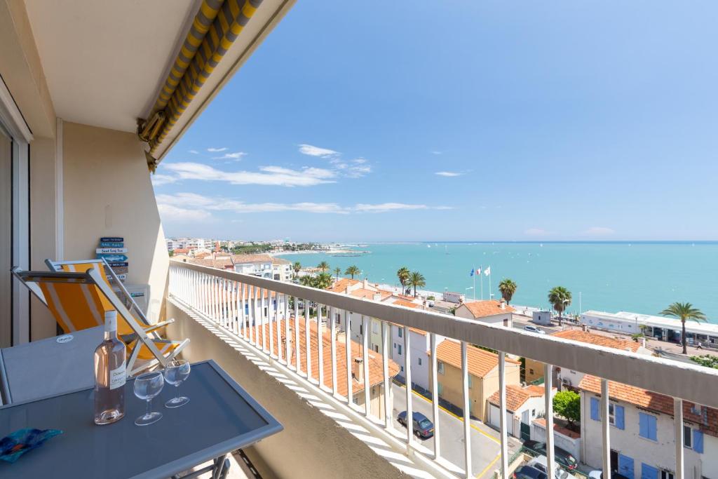 a balcony with a view of the ocean at GORGEOUS APT with TERRACE, ELEVATOR, AC, FREE PARKING - Le Régis in Cagnes-sur-Mer