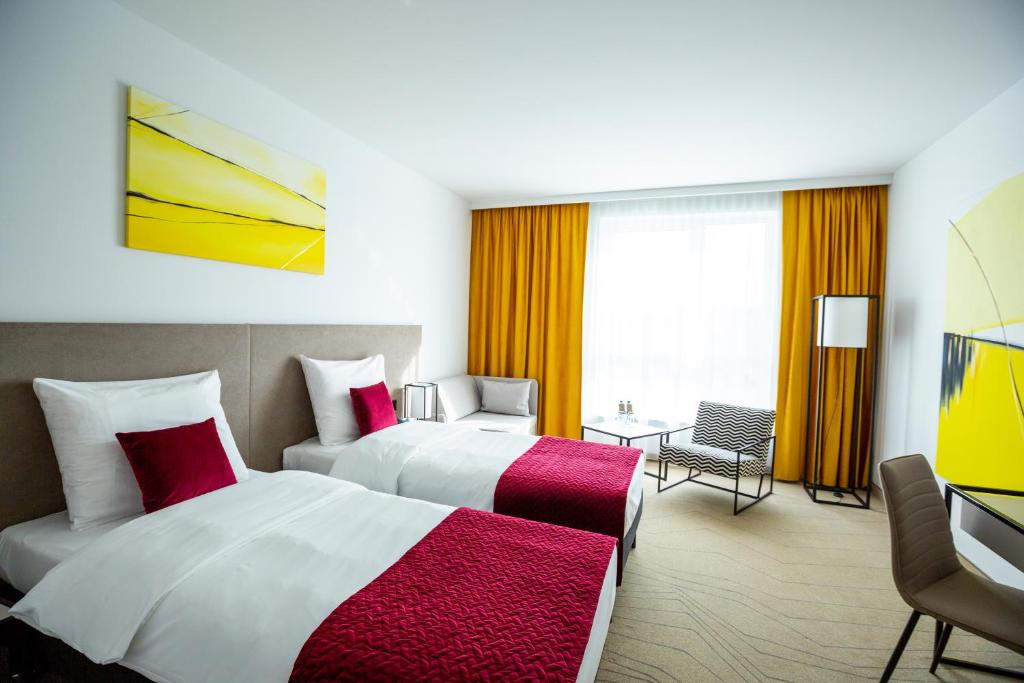 Posteľ alebo postele v izbe v ubytovaní Arche Hotel Krakowska