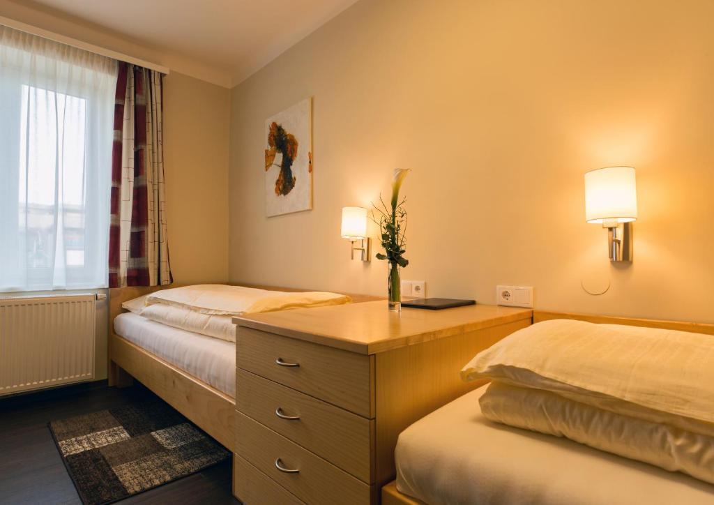 Postel nebo postele na pokoji v ubytování Hotel Guidassoni