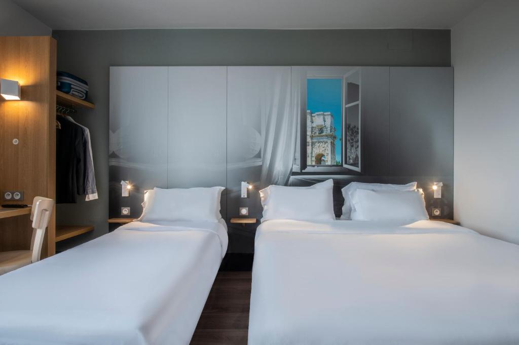 Postel nebo postele na pokoji v ubytování B&B HOTEL Orange