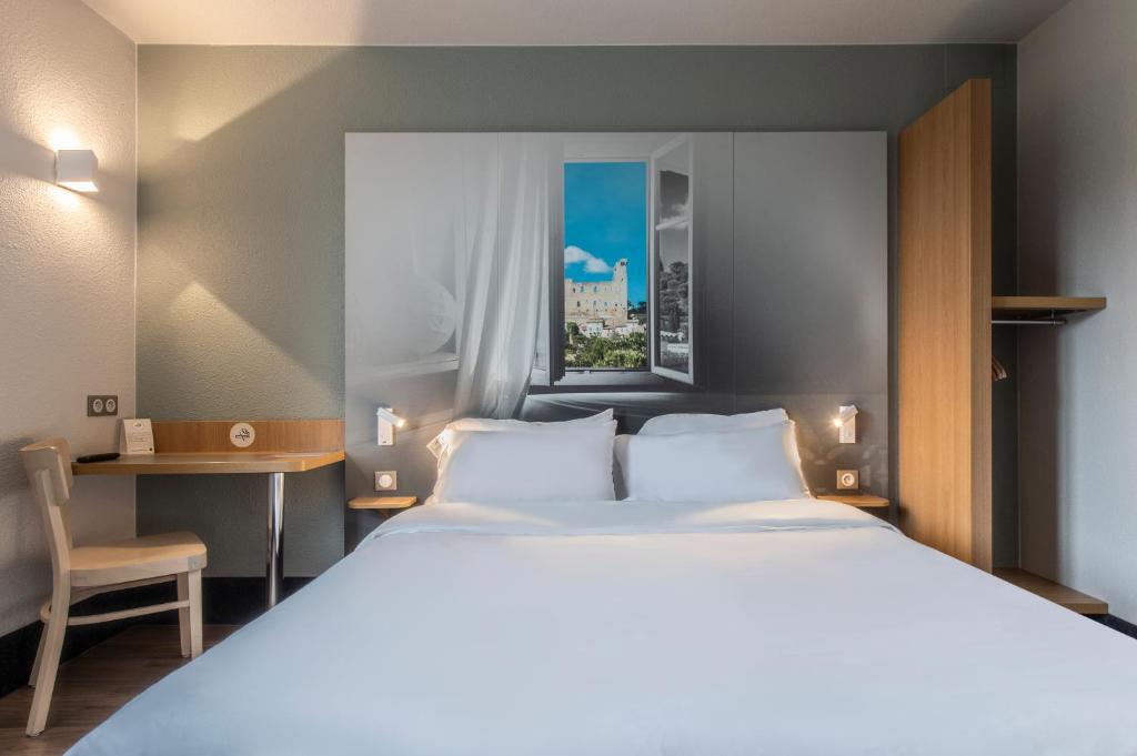 Postel nebo postele na pokoji v ubytování B&B HOTEL Orange