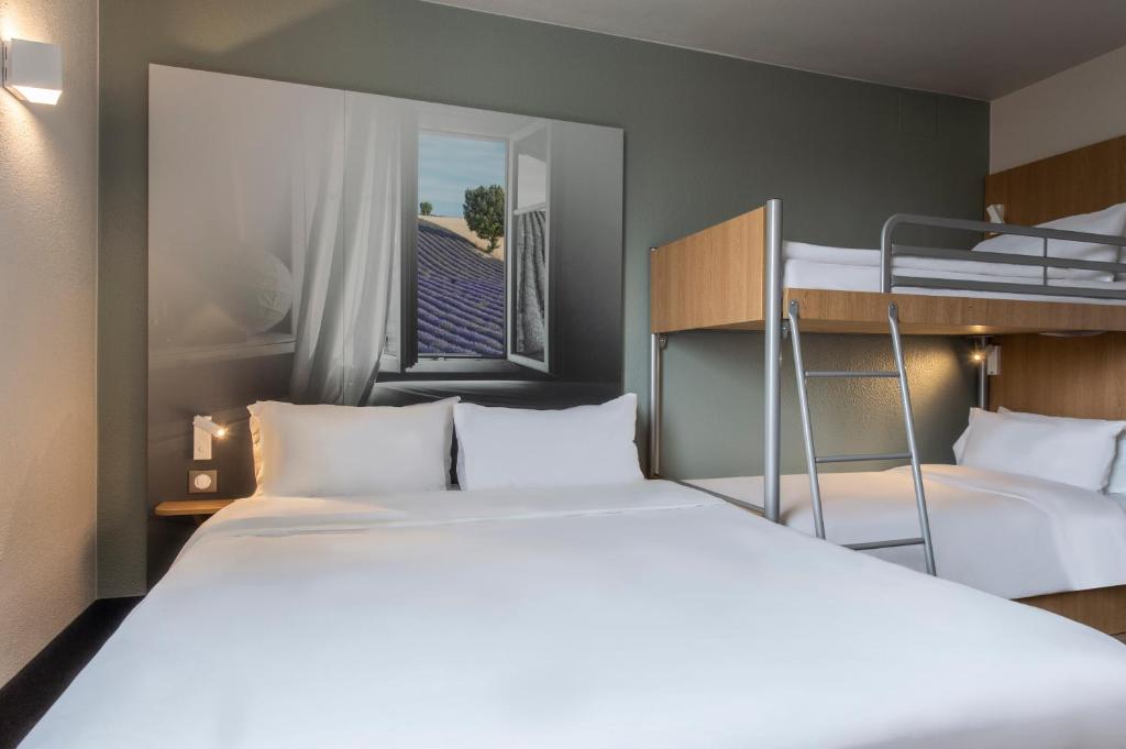 Postel nebo postele na pokoji v ubytování B&B HOTEL Orange