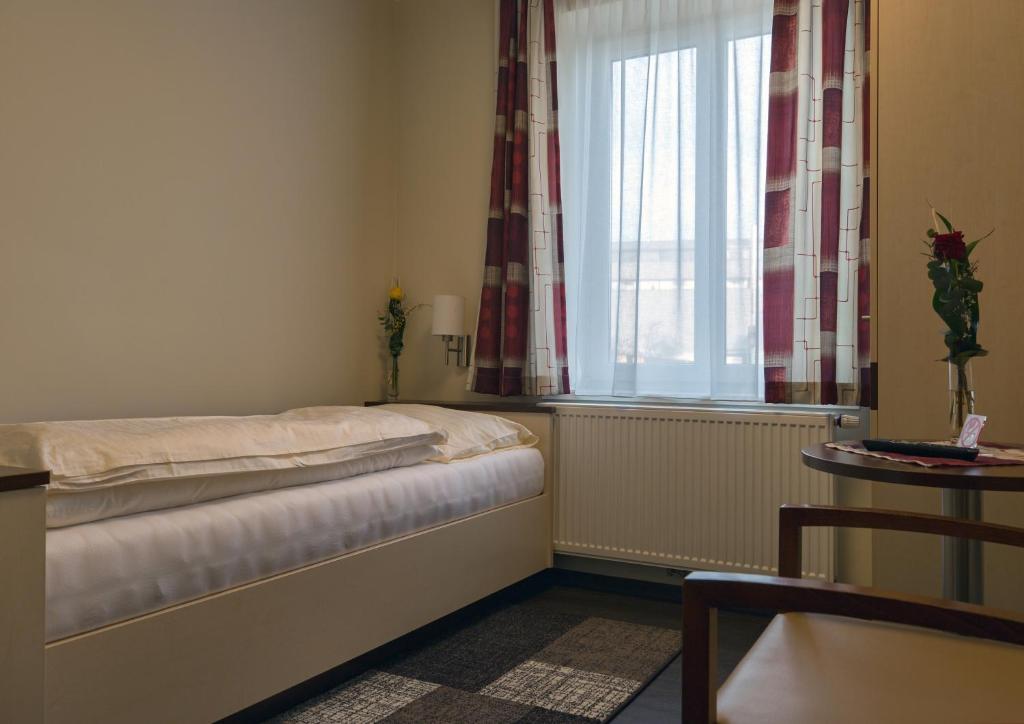 Postel nebo postele na pokoji v ubytování Hotel Guidassoni