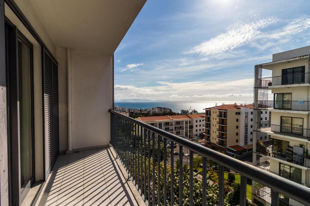 a balcony with a view of a city at Acacia Apartment by Atlântica in Funchal