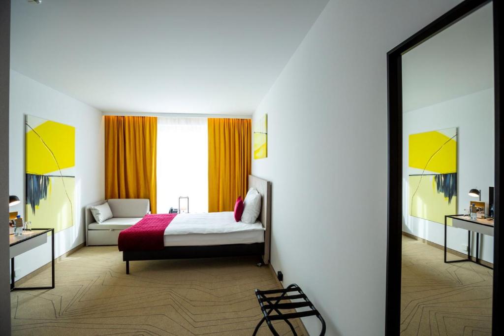 Posteľ alebo postele v izbe v ubytovaní Arche Hotel Krakowska
