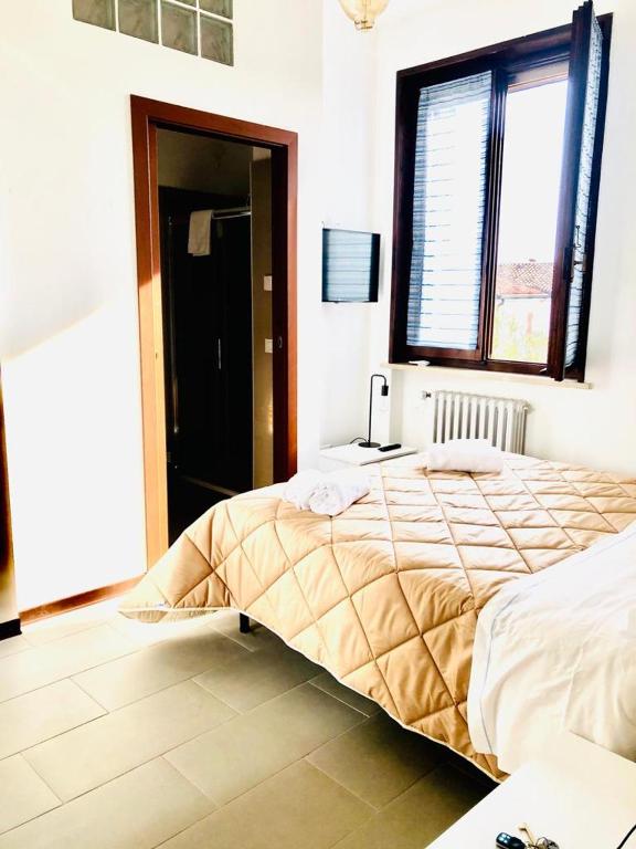 Postel nebo postele na pokoji v ubytování B&B Villa Ermanna