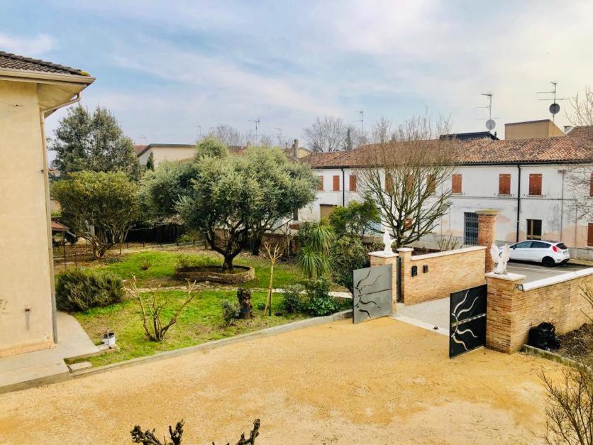 a view of a house with a driveway and a yard at B&B Villa Ermanna in Mantova