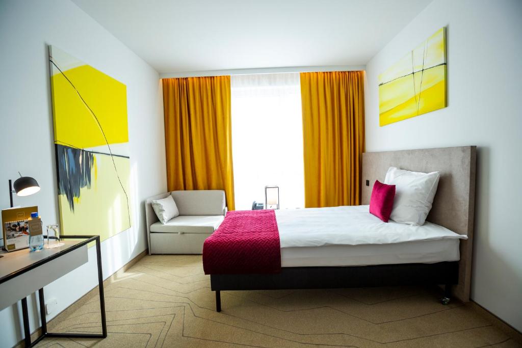 Posteľ alebo postele v izbe v ubytovaní Arche Hotel Krakowska