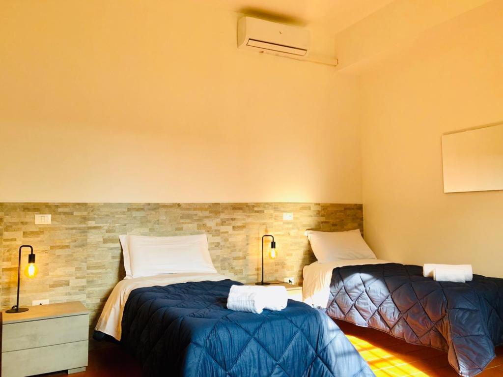 Postel nebo postele na pokoji v ubytování B&B Villa Ermanna