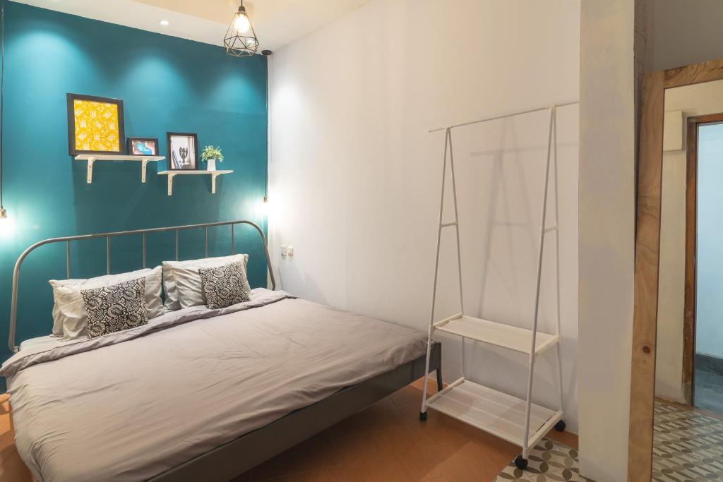 Postel nebo postele na pokoji v ubytování Wonderloft Hostel Jogja