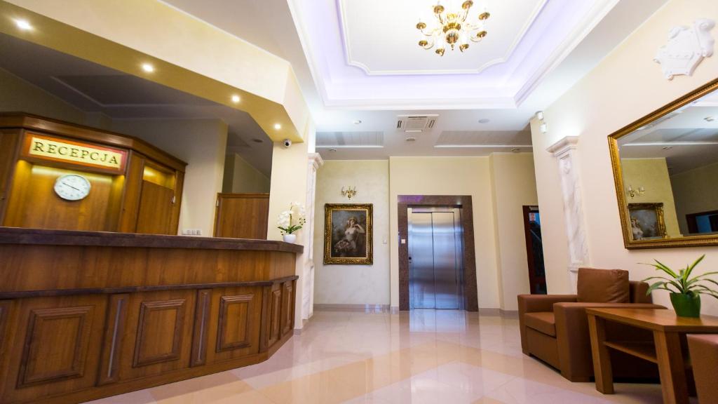 a hospital lobby with a reception desk and a waiting room at ELGROM Falenty Park in Raszyn