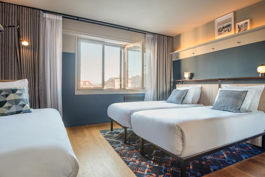 Postel nebo postele na pokoji v ubytování Hotel Kaijoo by HappyCulture